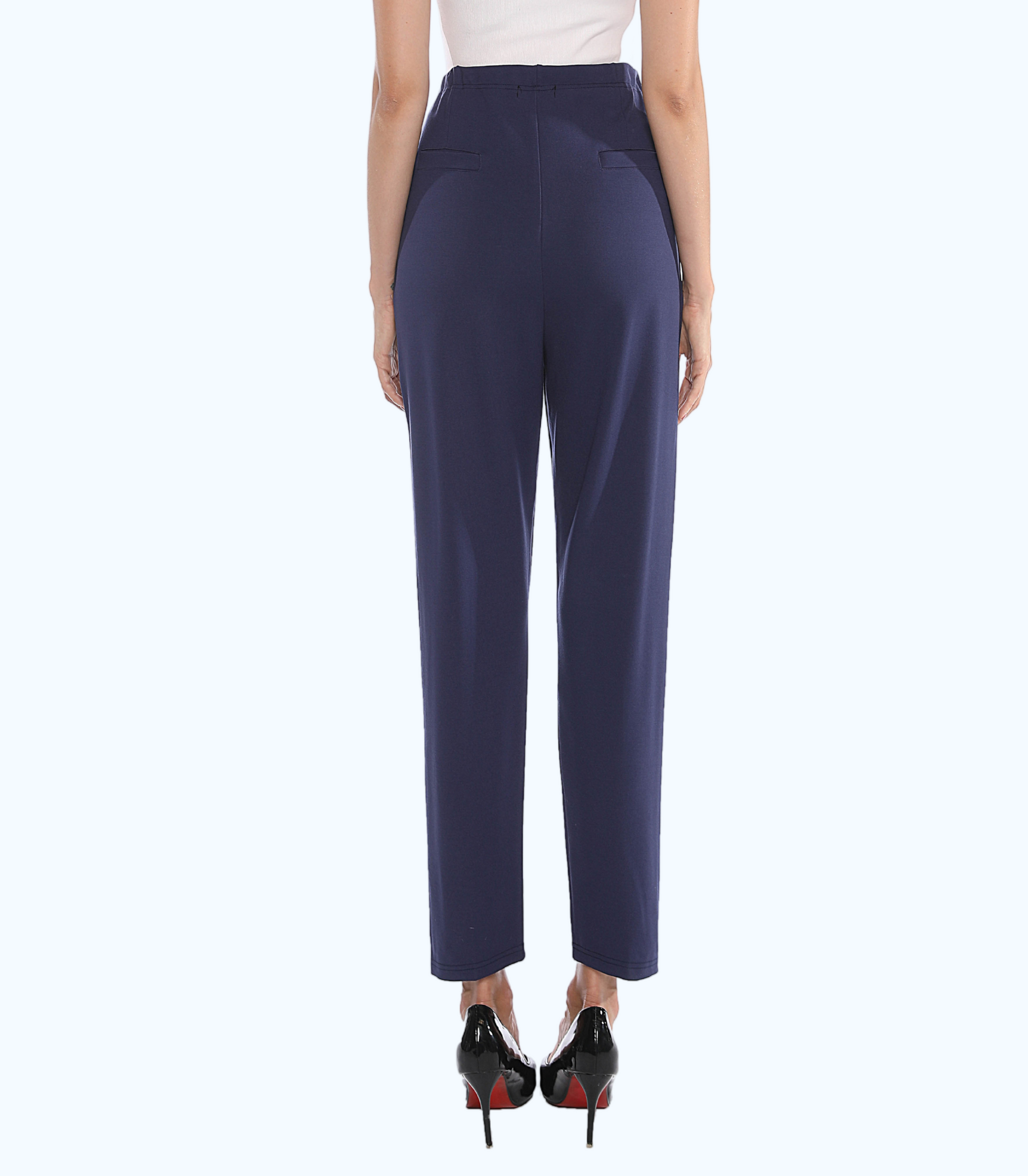 Navy blue pants worn by a person on a white background