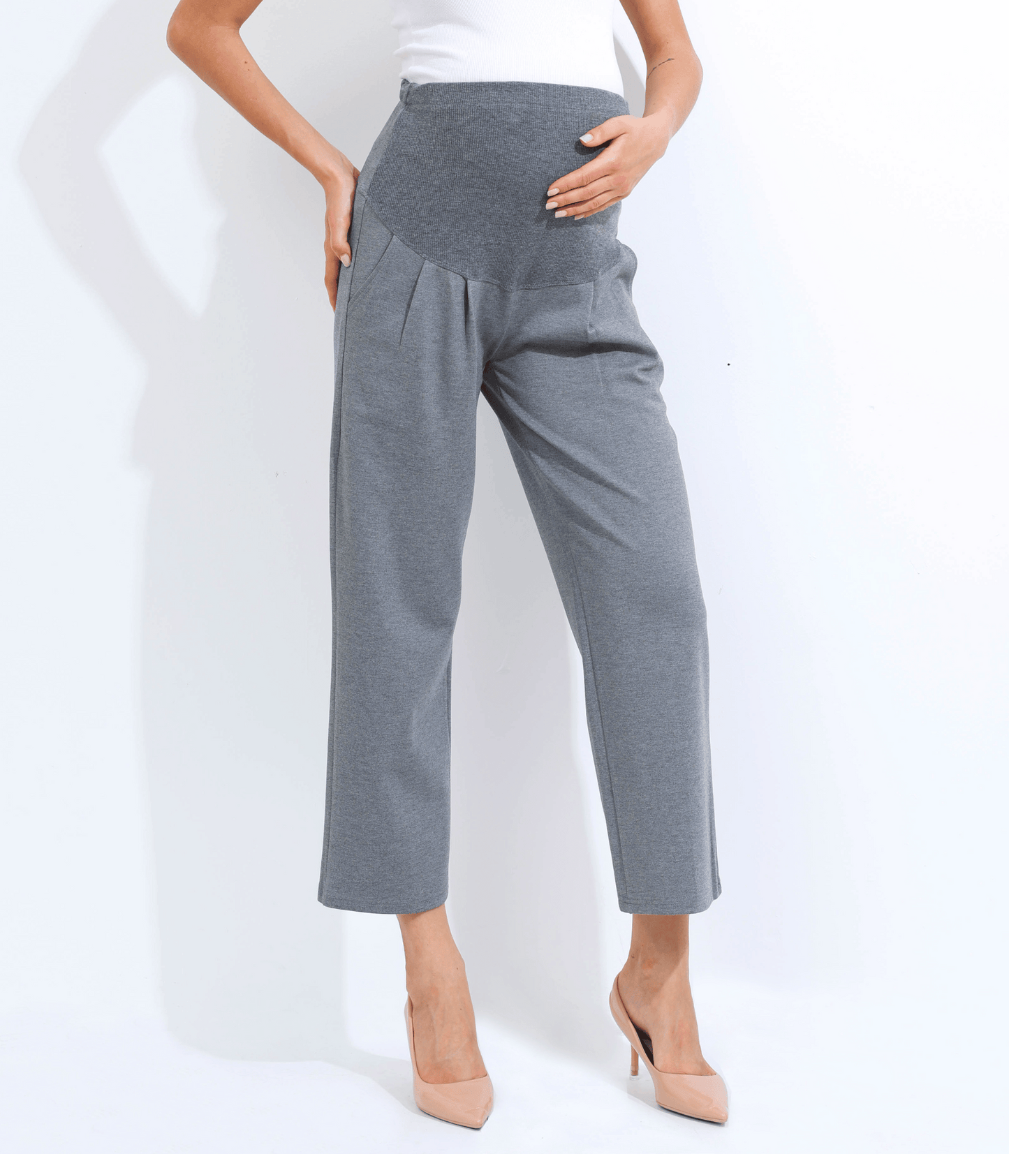Gray high-waisted pants worn by a person on a white background