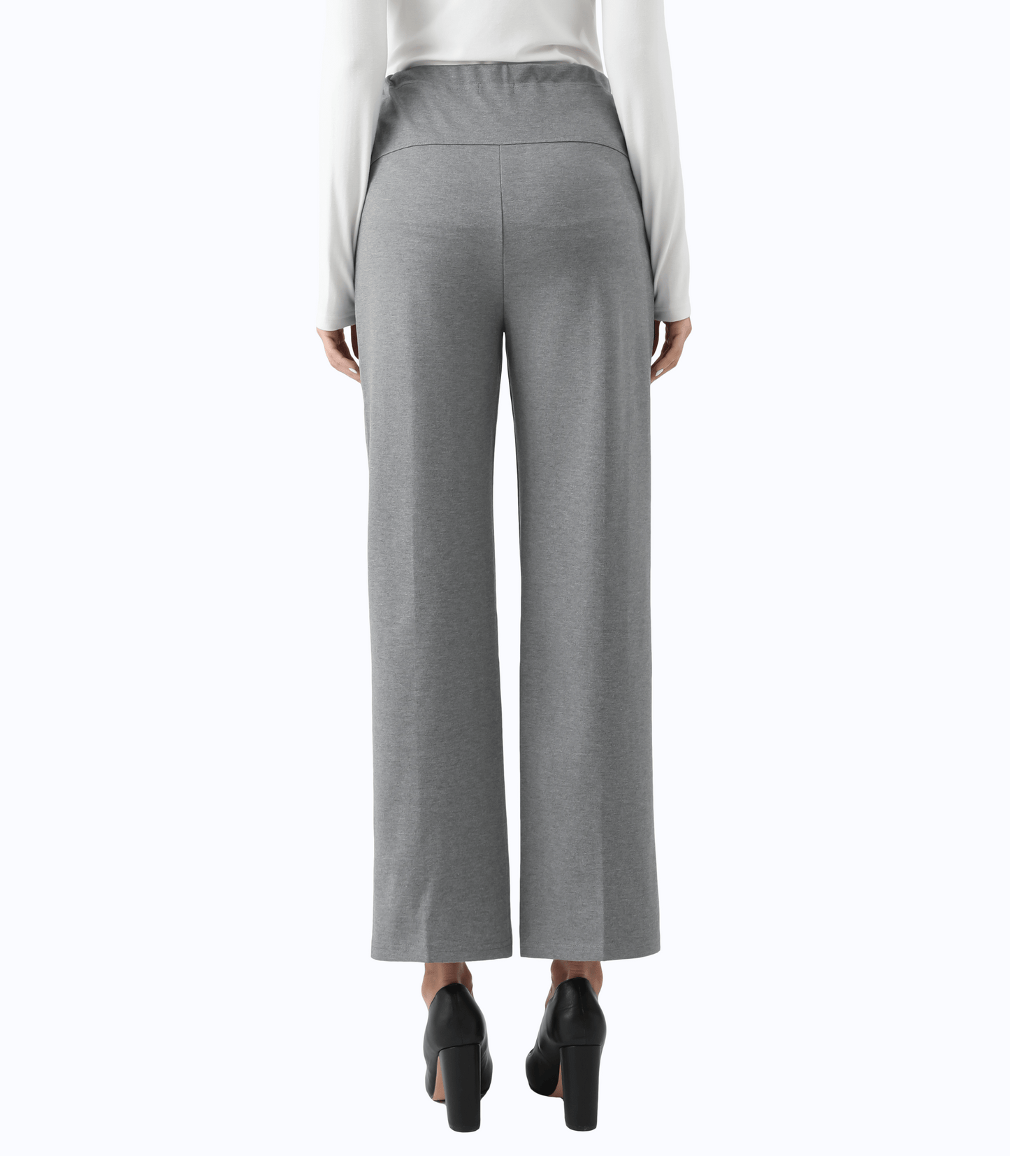Gray wide-leg pants worn with a white top on a white background