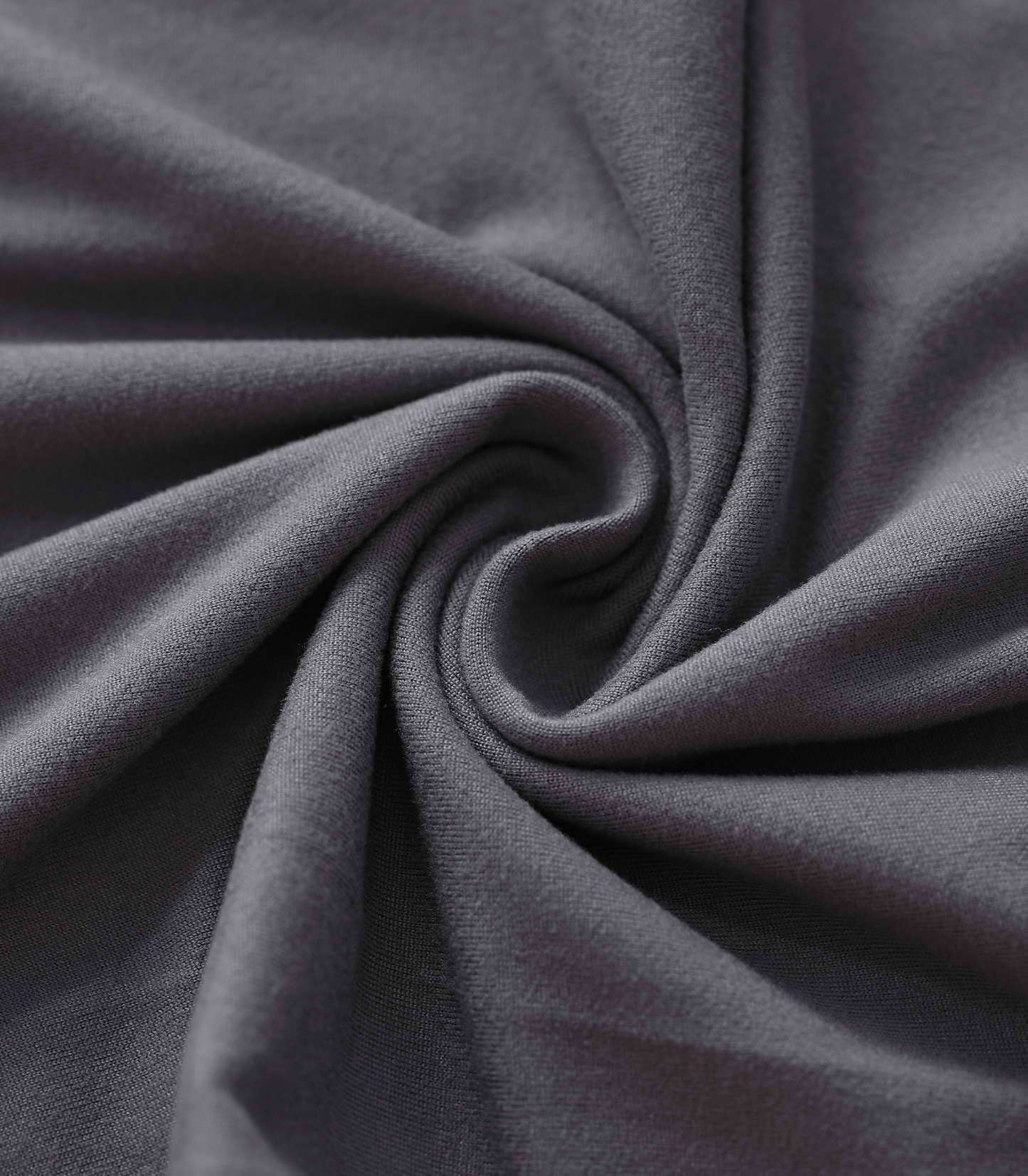 Close-up of dark gray fabric with folds