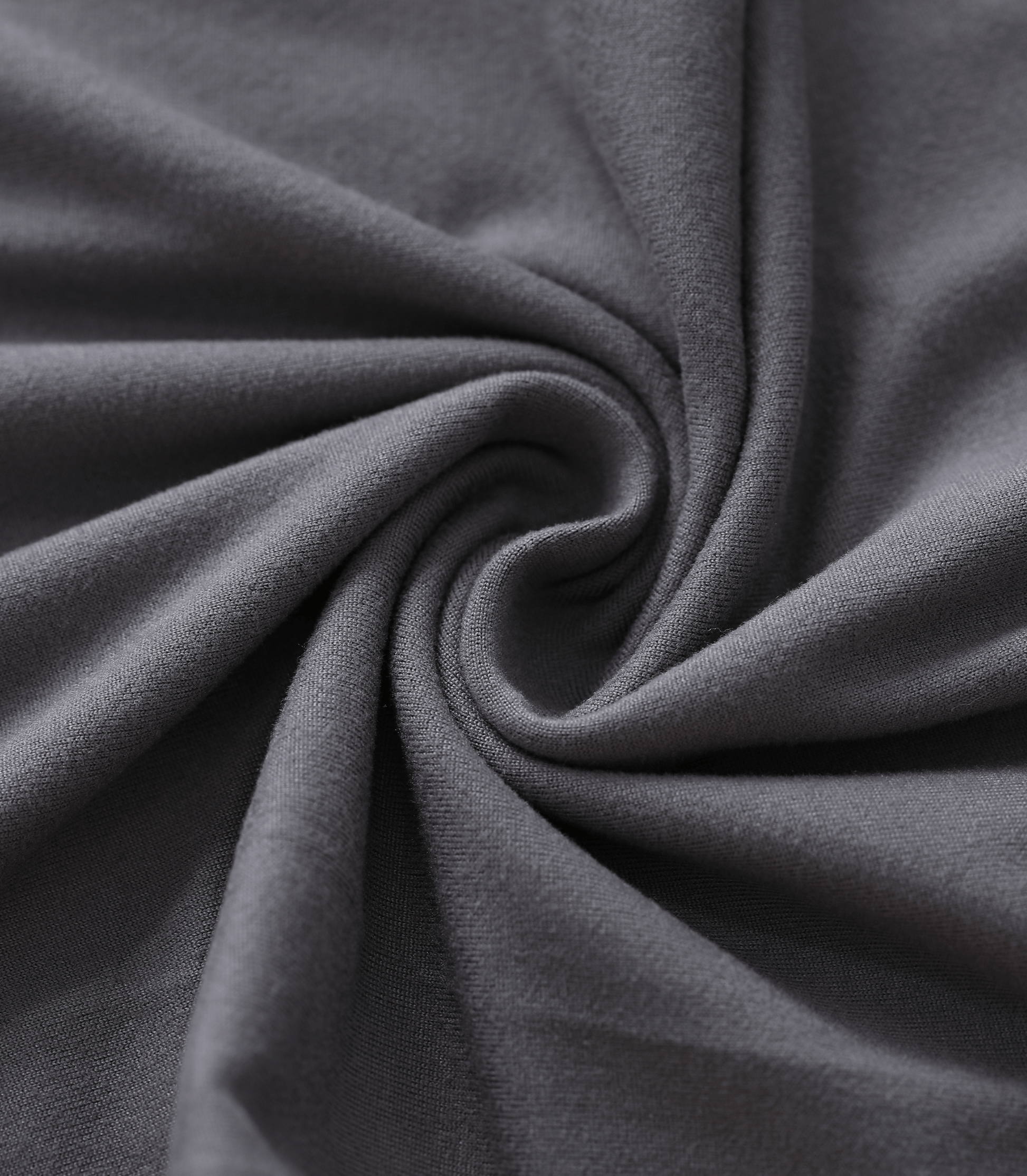 Close-up of dark gray fabric with folds