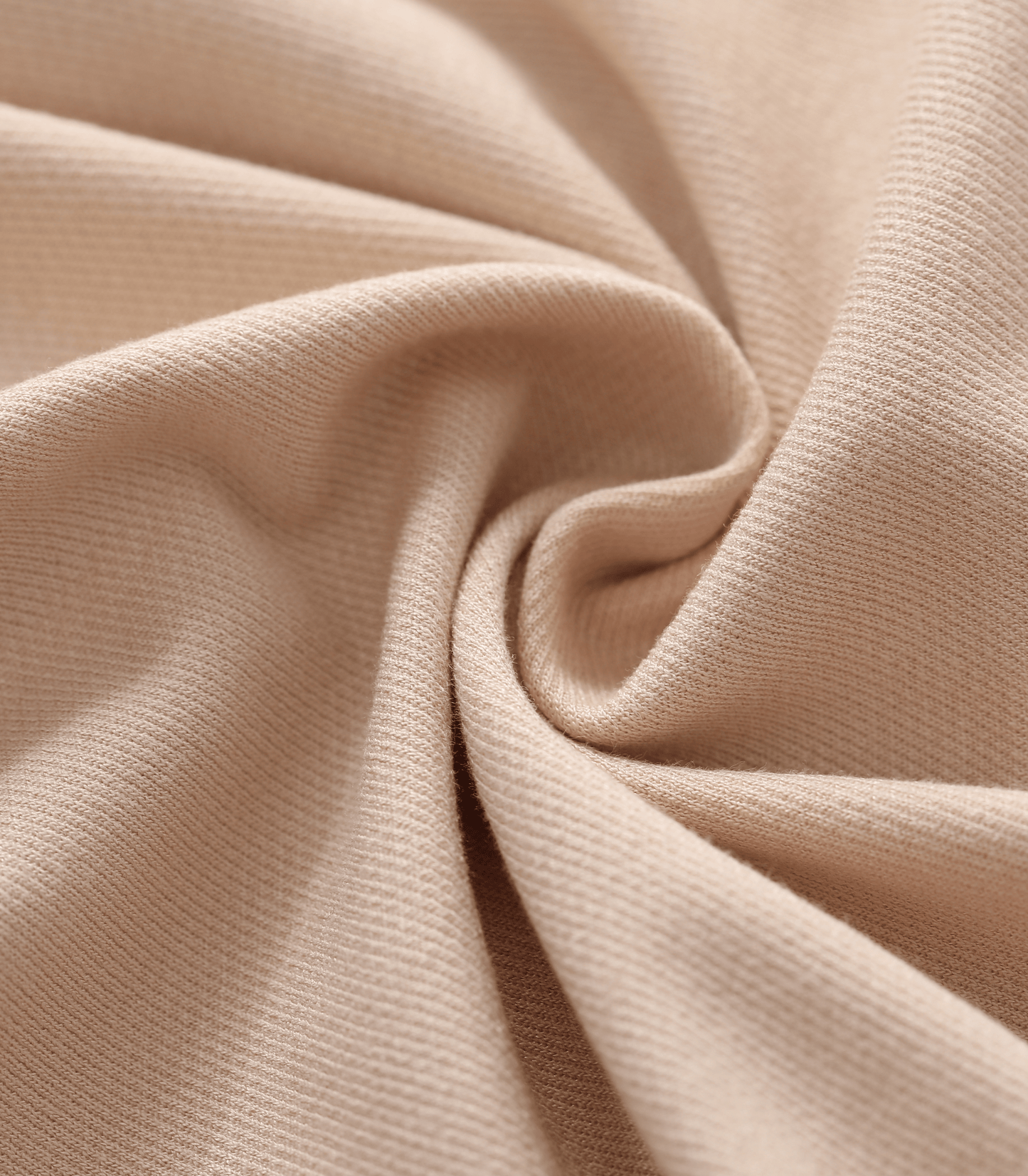 Close-up of beige fabric with folds