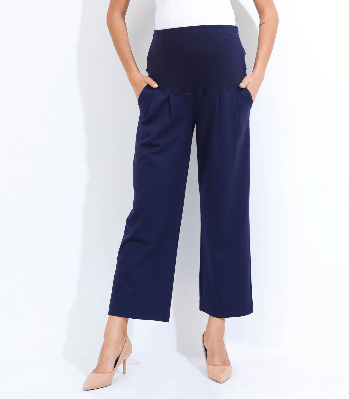 Navy blue wide-leg pants worn by a person on a white background