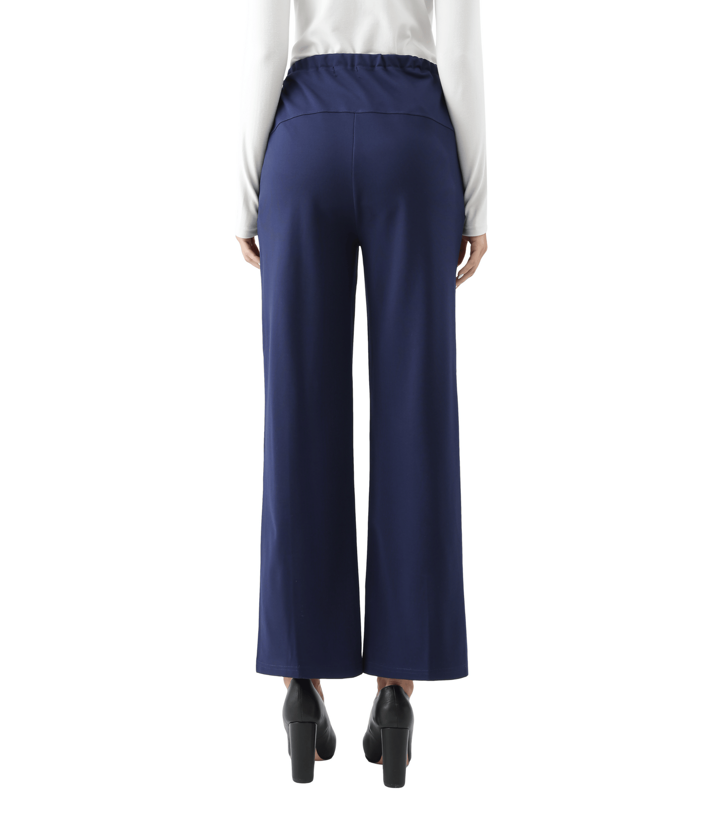 Navy blue wide-leg pants worn with a white shirt on a white background