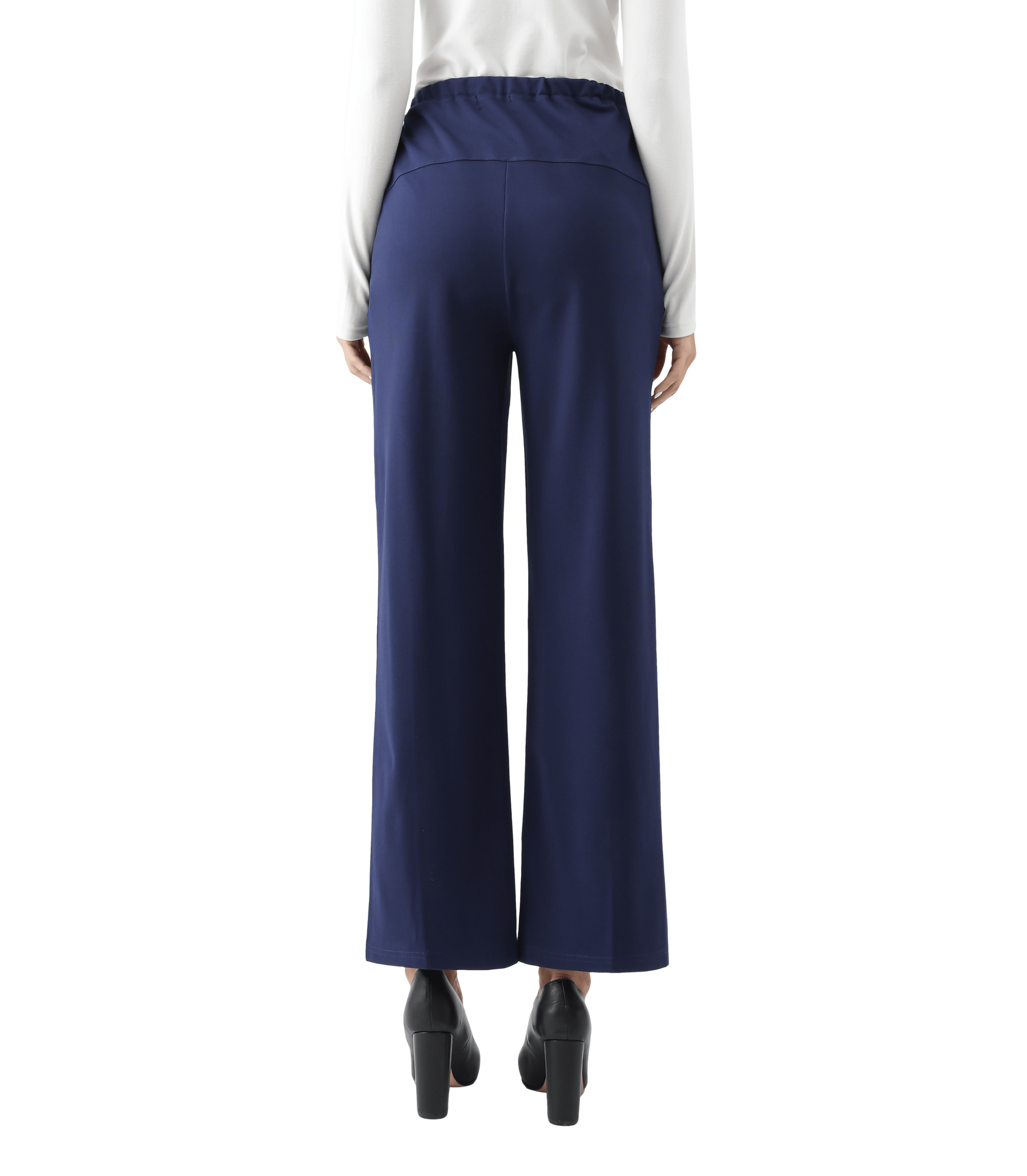 Navy blue wide-leg pants worn with a white shirt on a white background