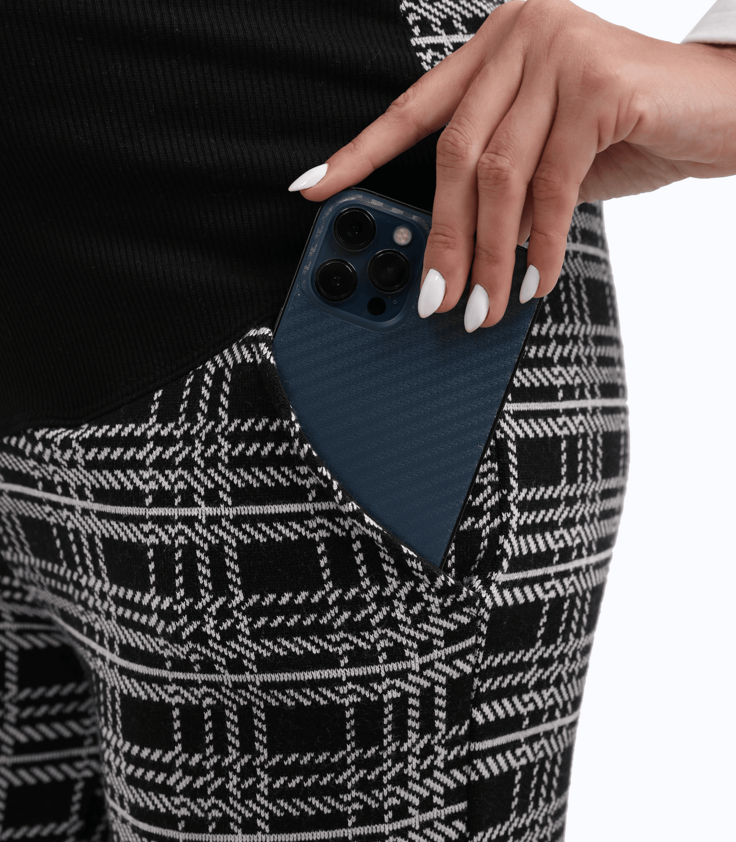 Person holding a blue phone case with a textured pattern