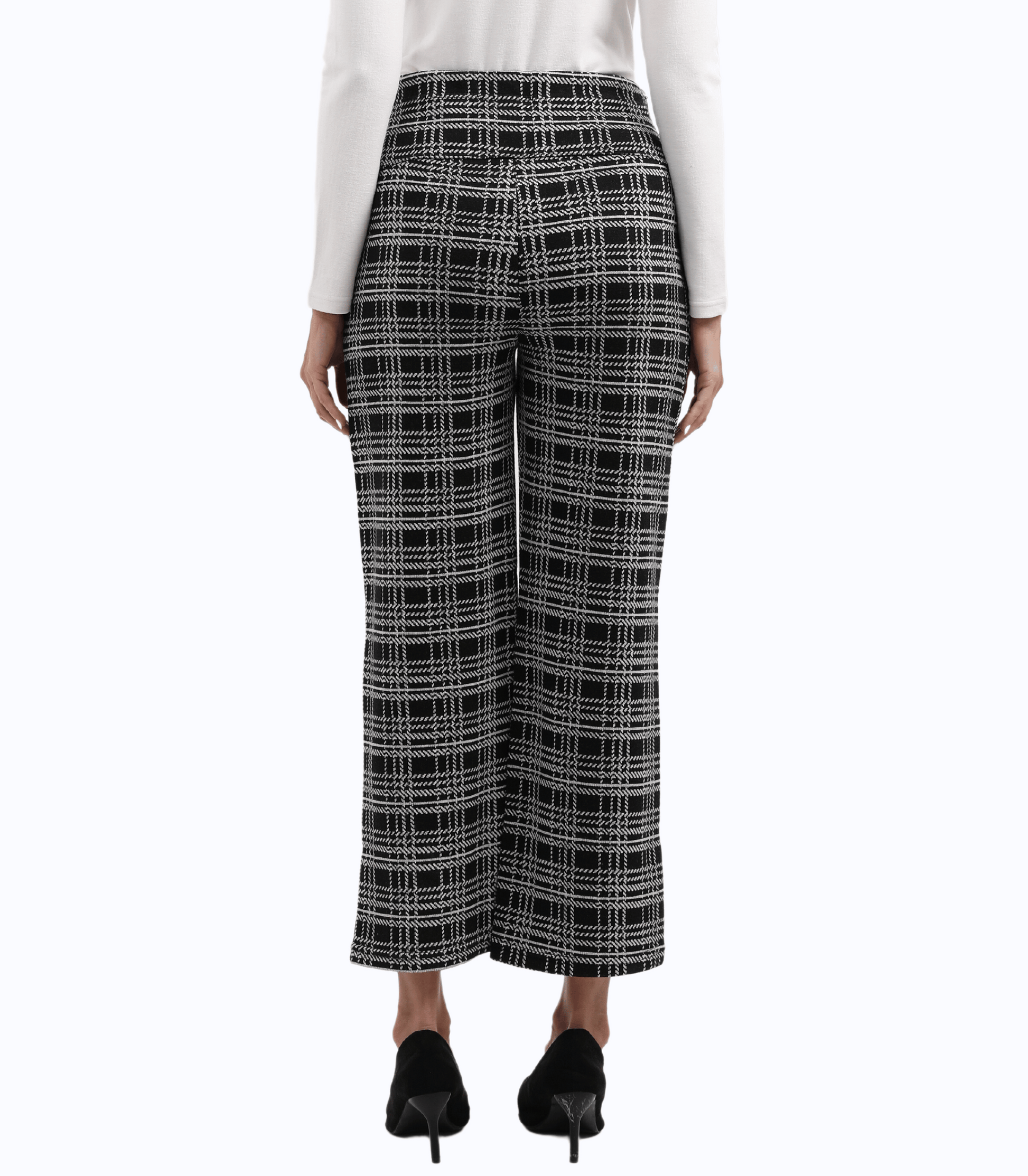 Black and white plaid pants worn by a person on a white background