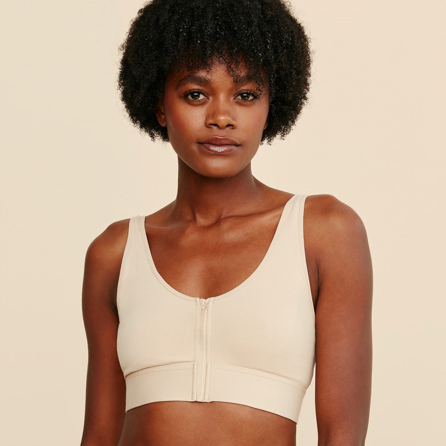Beige cotton bralette with front zipper placket and scoop neckline