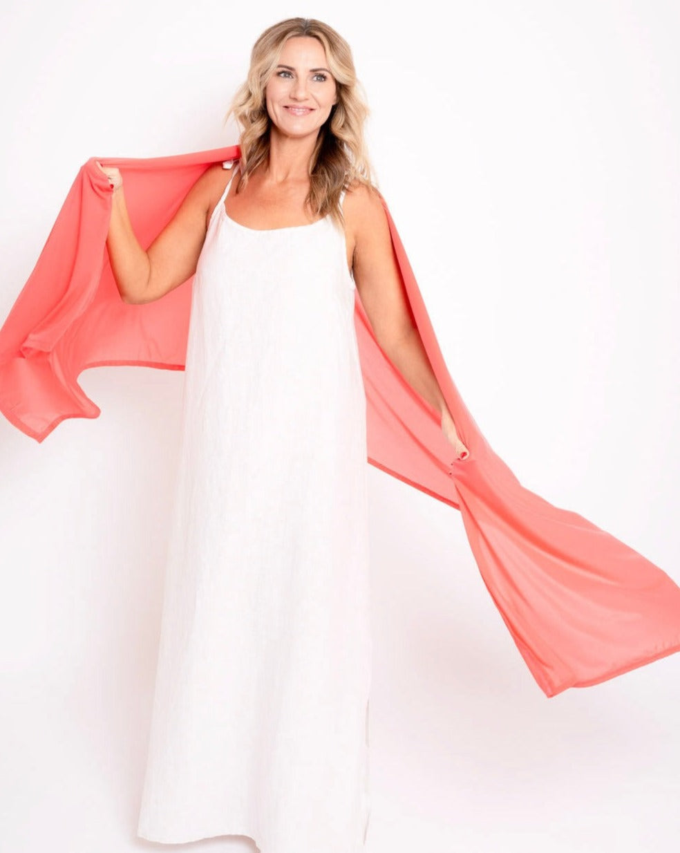 Mesh sun wrap in coral red, flowing sheer panel with airy texture