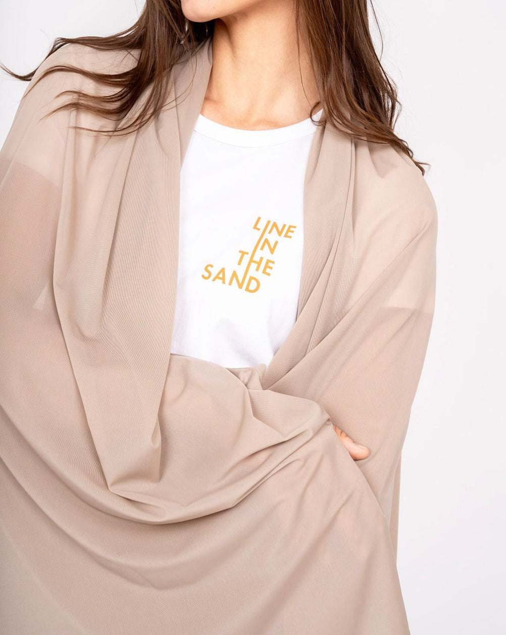 Beige mesh sun wrap with open front and draped sleeve panel