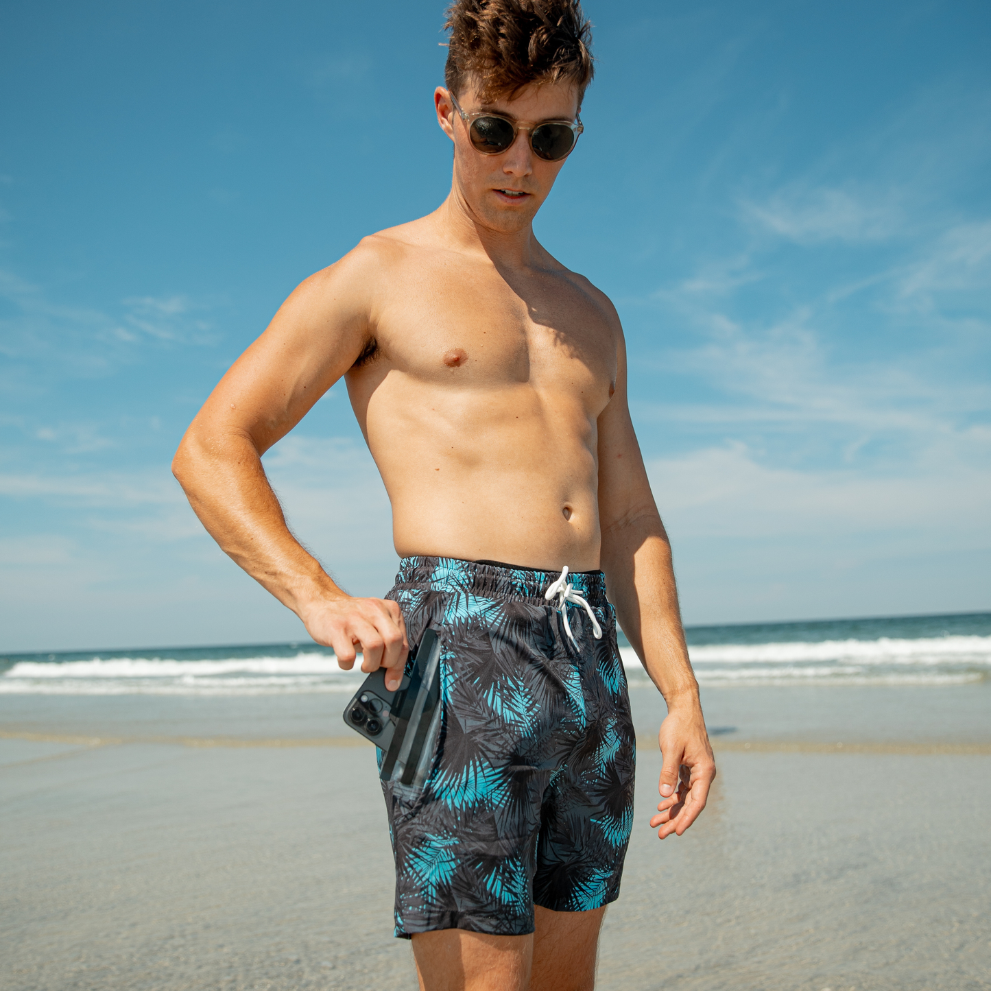 Men's teal palm-print swim shorts, elastic waistband with white drawstring