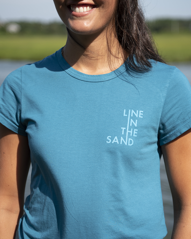 Wave graphic T-shirt with crew neck, short sleeves, and 'LINE IN THE SAND' print