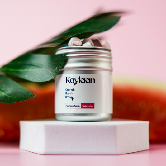 Metal jar of Kaylaan watermelon toothpaste tablets, Crunch Brush Smile label