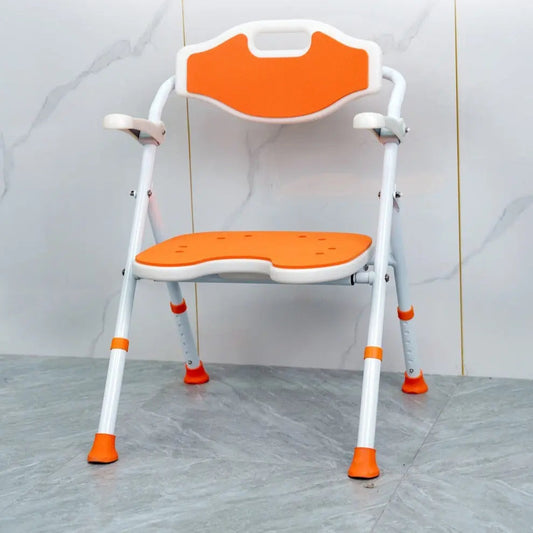 Orange and white adjustable shower chair against a tiled wall.