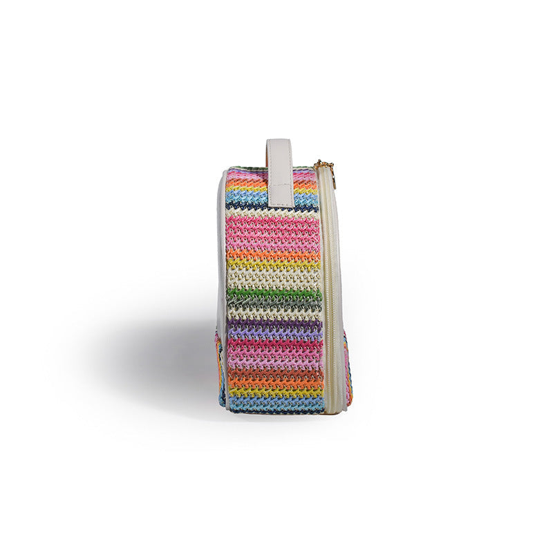 Small transparent PVC cosmetic bag with rainbow striped knit panel and vertical strap