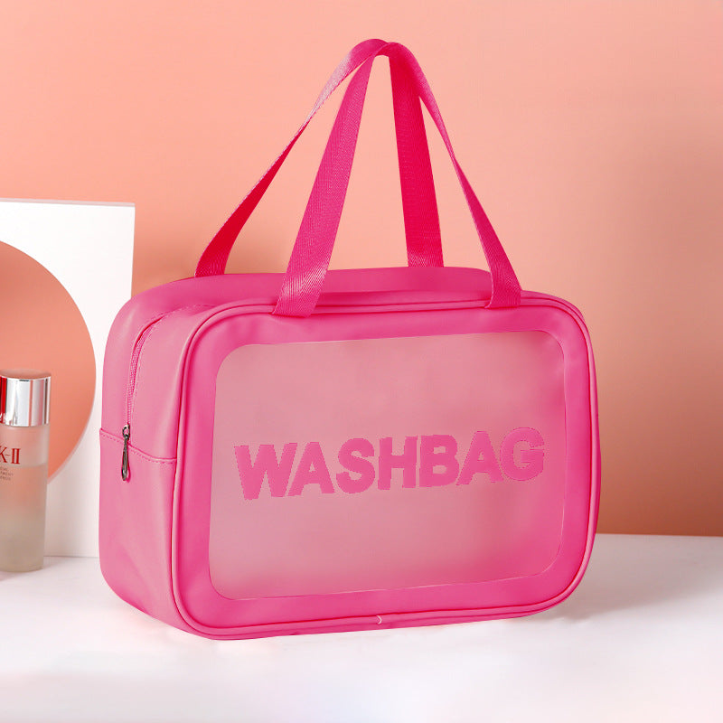Pink frosted PVC washbag with translucent window and top handle, compact travel size