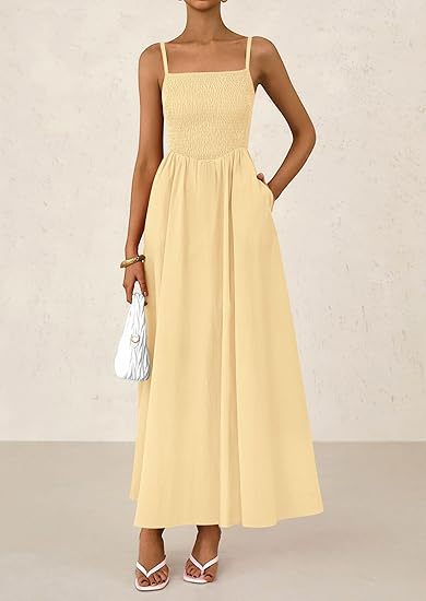 Women's thin-strap midi dress in pale yellow with smocked bodice and pleated skirt