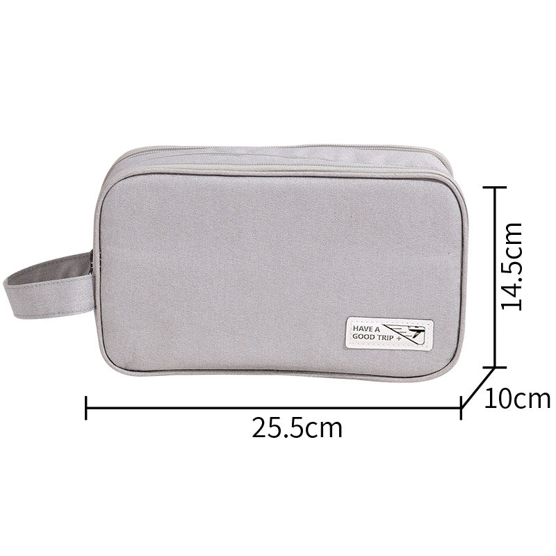 Three-layer travel toiletry bag, light grey zippered pouch with side handle strap and front label