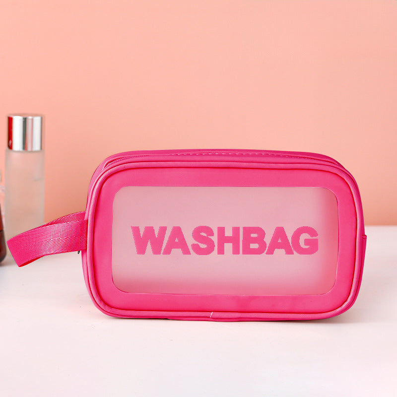 Pink frosted PVC zip pouch with translucent front panel and side strap for cosmetics