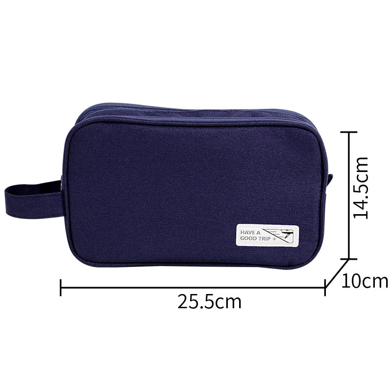 Three-layer travel toiletry bag, navy zippered pouch with side handle strap and front label