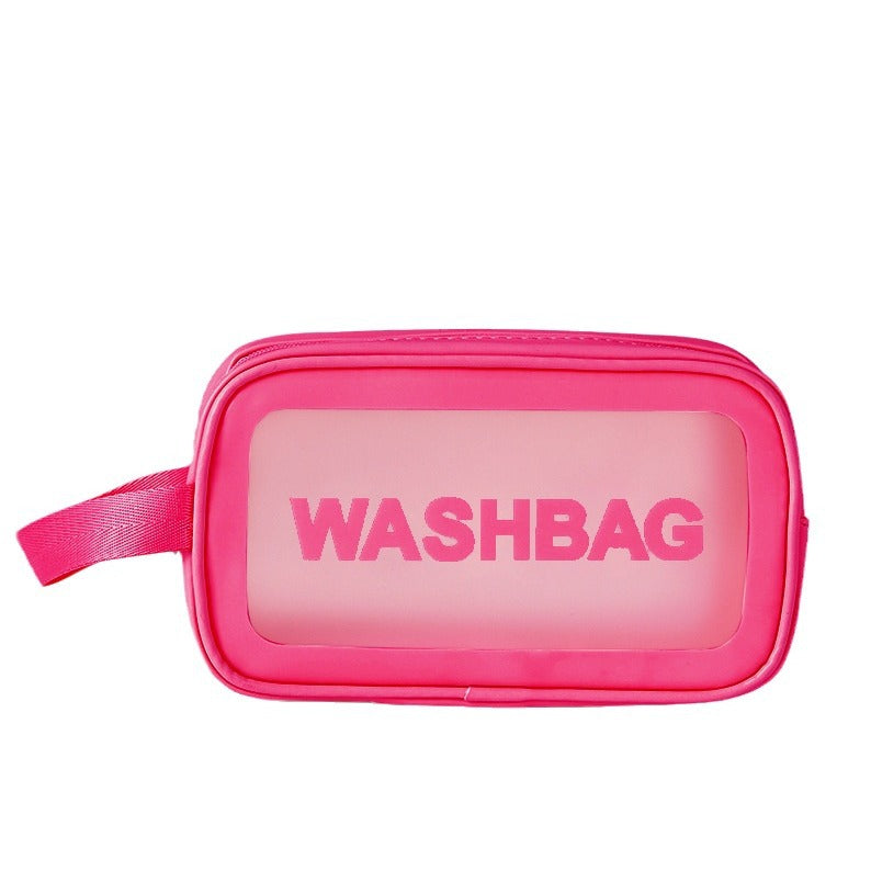 Pink frosted PVC zip pouch with translucent panel and wrist strap for travel toiletries