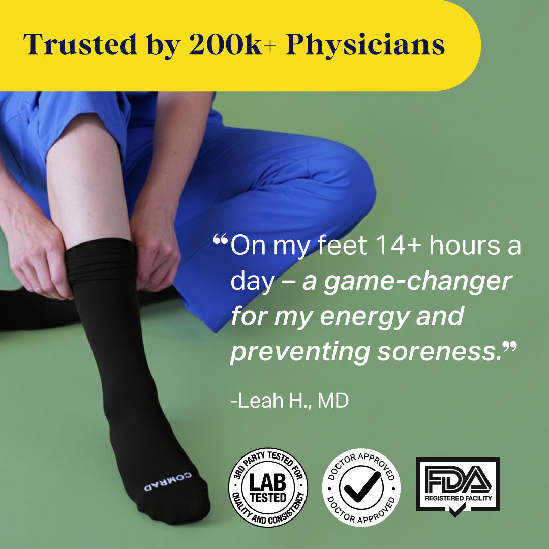 Black knee-high compression socks on legs, snug ribbed texture