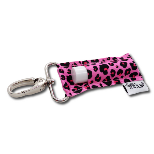 Lippy Clip with pink leopard print cover and white lip balm on a white background