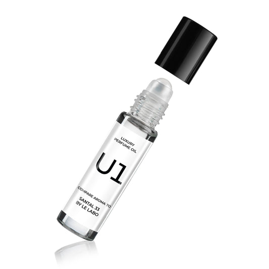 Perfume oil bottle with black cap and U1 label, shown tilted.