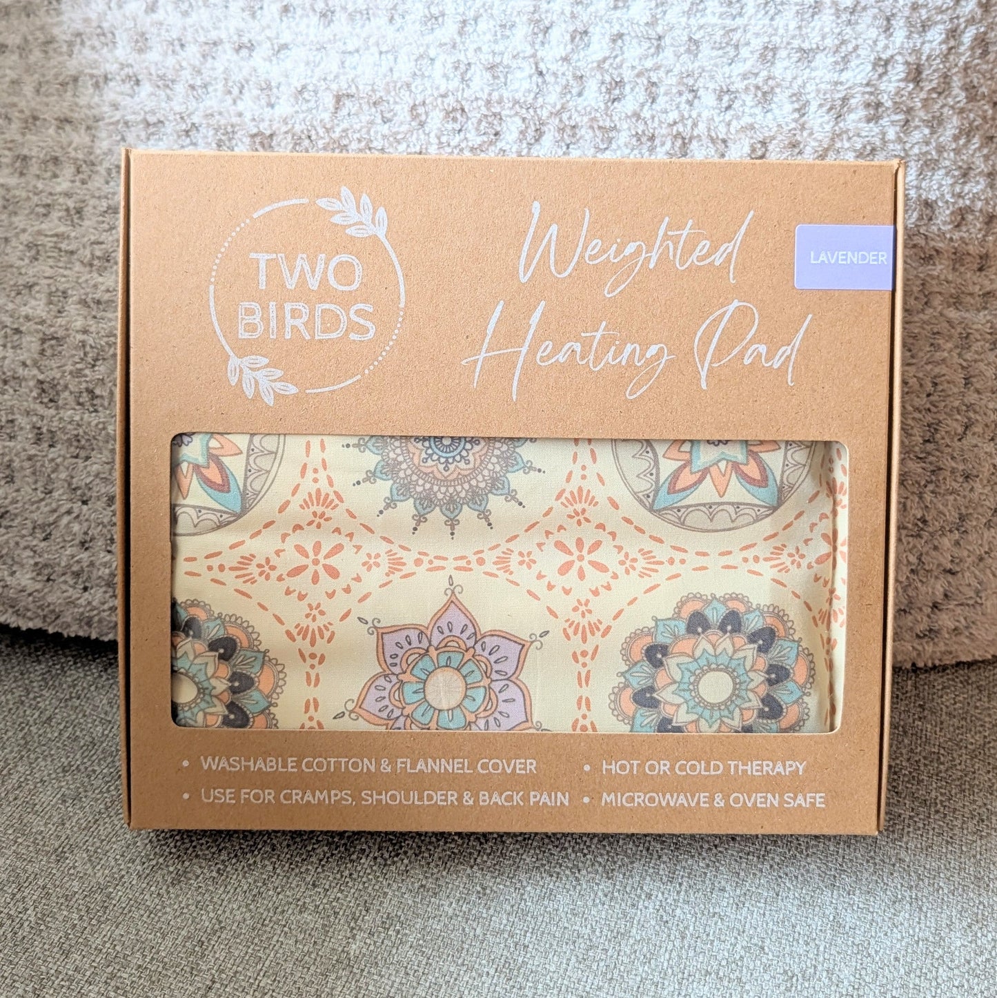Weighted heating pad gift box with lavender-scent label and floral cotton flannel cover