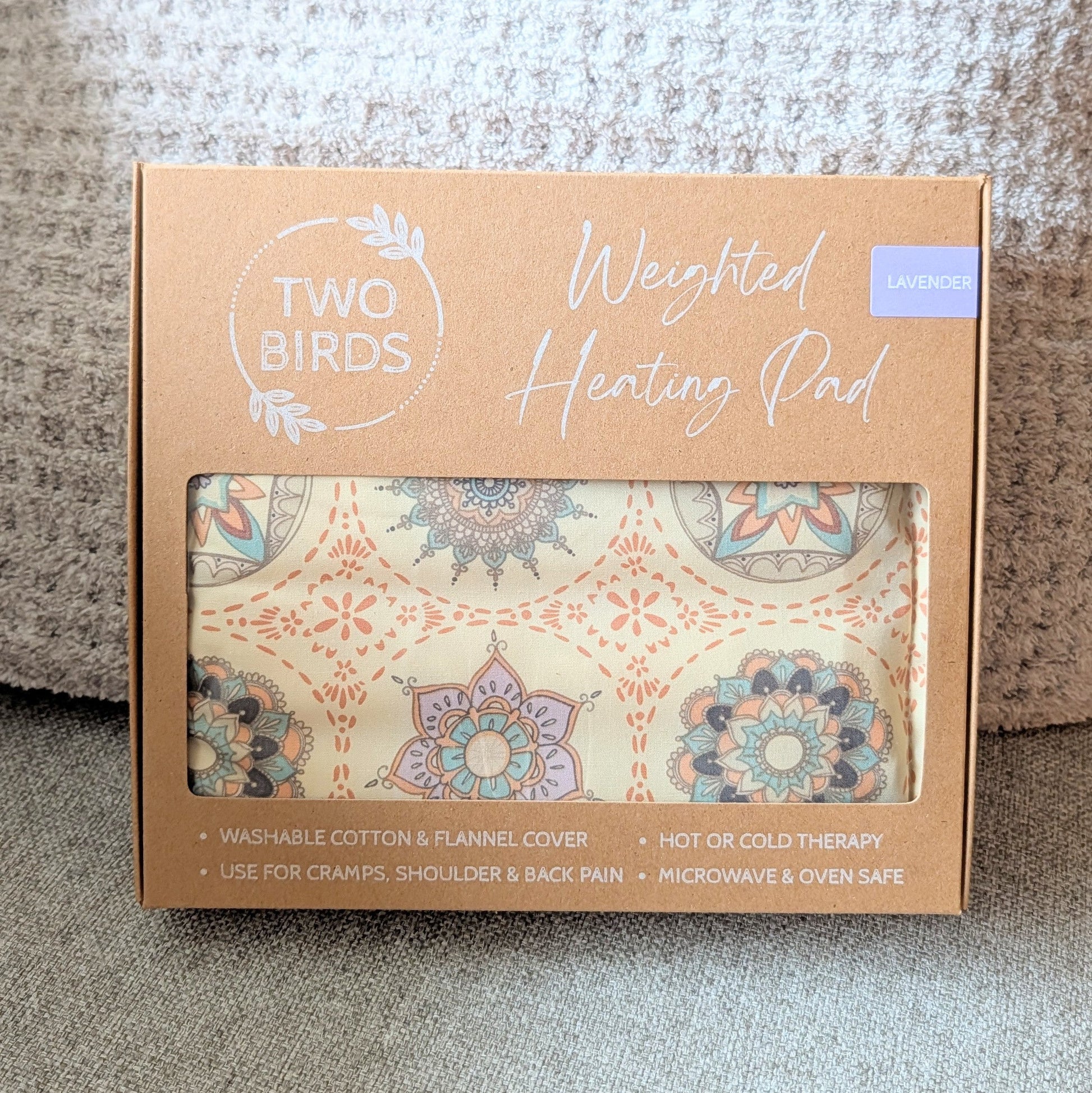 Weighted heating pad gift box with lavender-scent label and floral cotton flannel cover