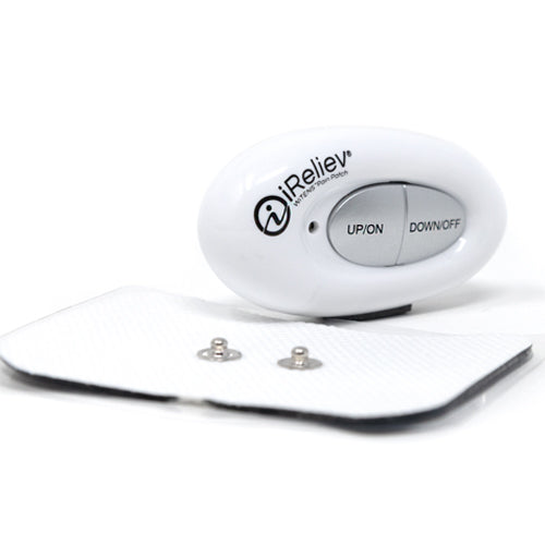 White controller unit on textured adhesive pad with two metal electrode caps