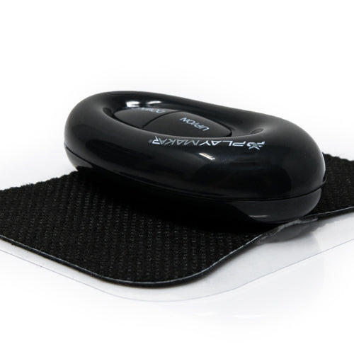 Black Wireless TENS controller on textured electrode pad