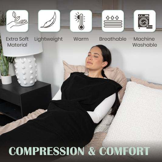 Black wearable compression hoodie-blanket with hood, covering torso, arms, and legs