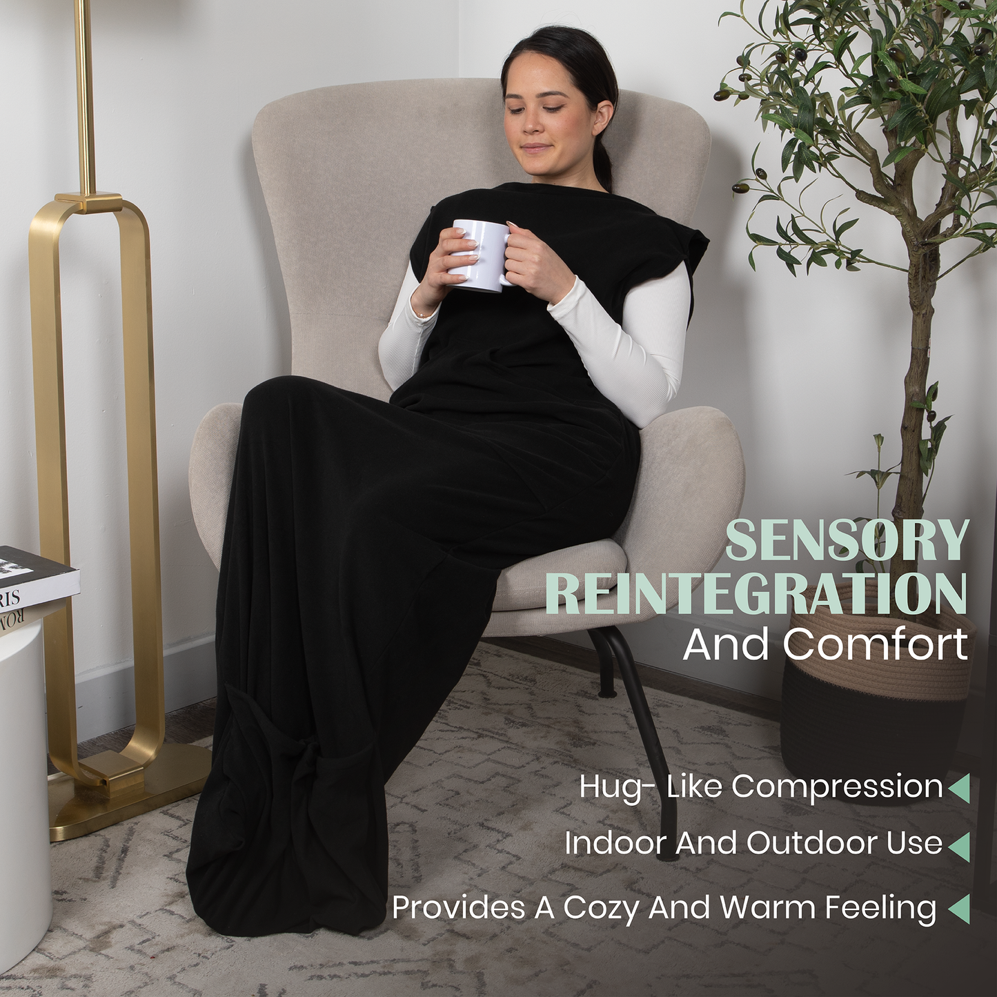 Black wearable compression hoodie-blanket with hood, arm covers, and full-length legs