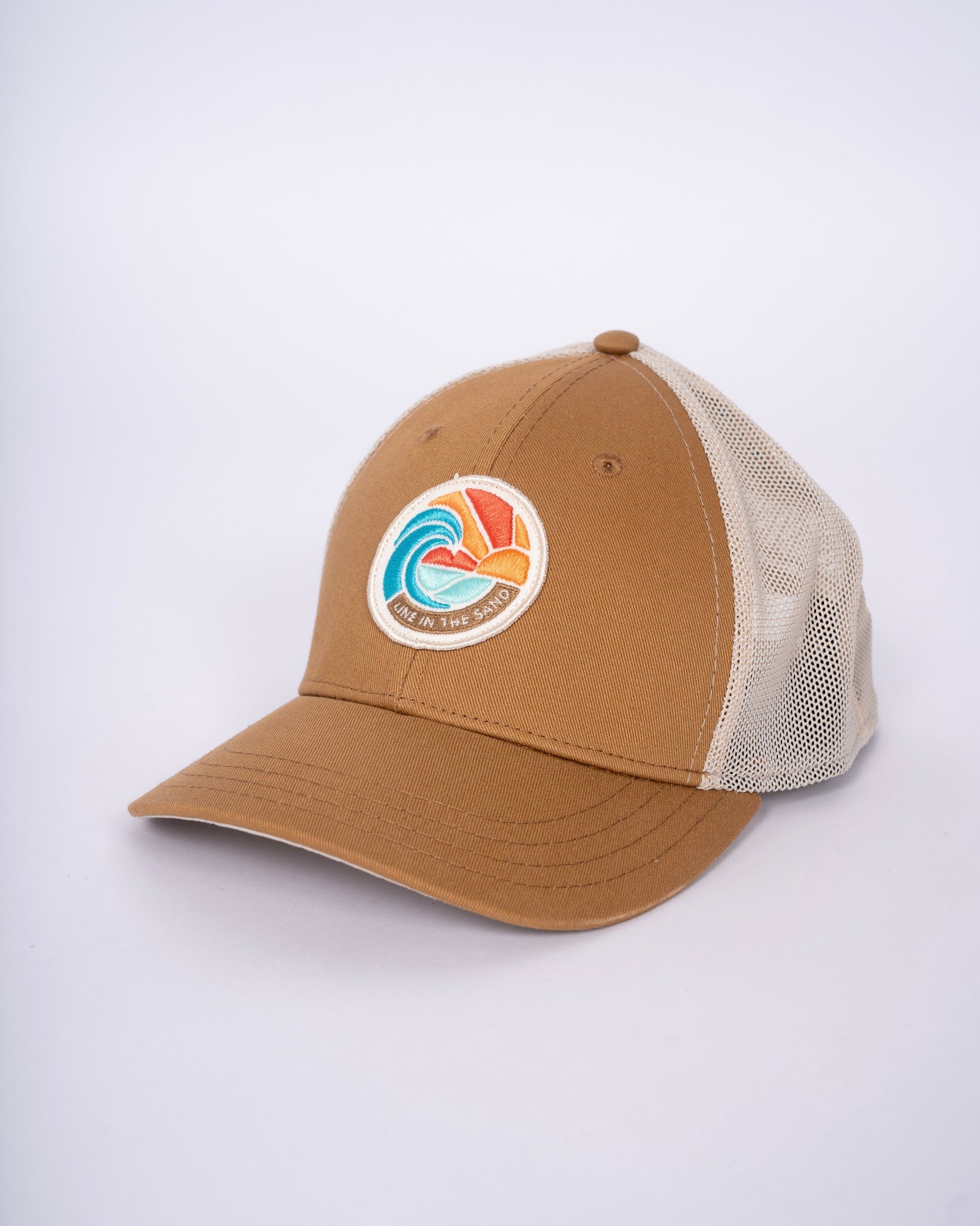 Tan retro patch baseball cap with white mesh side panels and front circular emblem