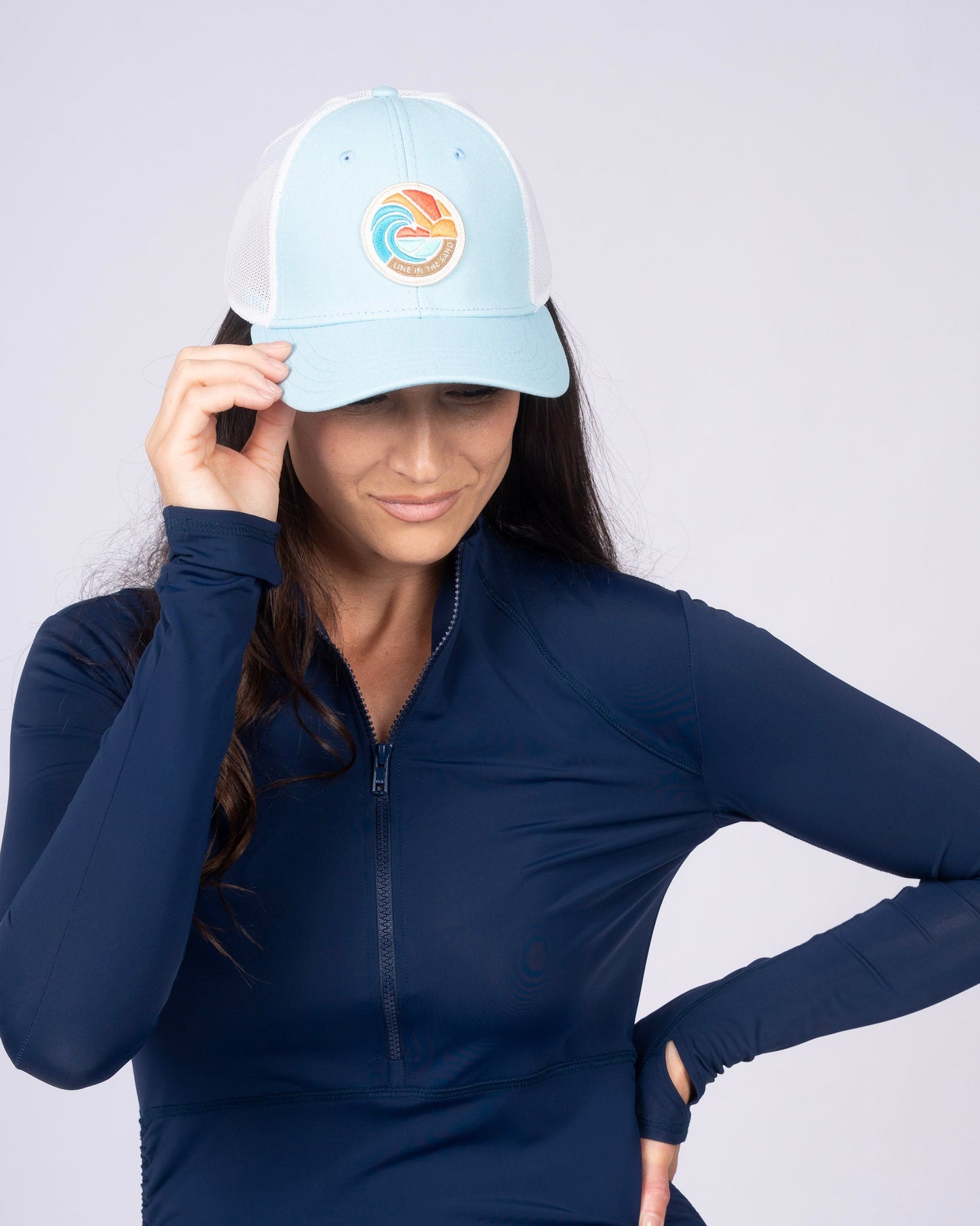 Light blue retro patch baseball cap with white mesh side panels and front emblem