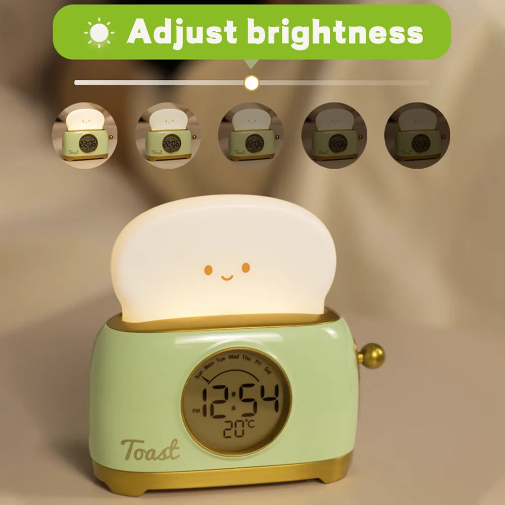 Green toaster night light alarm clock with glowing lid and digital clock face