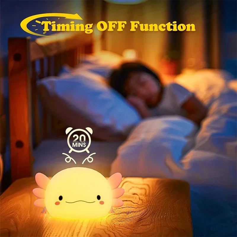 Glowing cream axolotl night light with pink fins on a bedside, smiling face