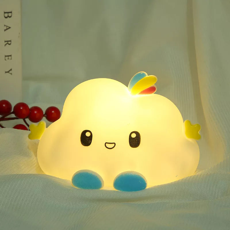 White cloud LED night light with smiling face, rainbow top, and blue rounded base