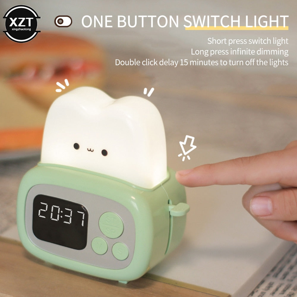 Green toaster-shaped alarm clock night light with glowing top and 20:37 display
