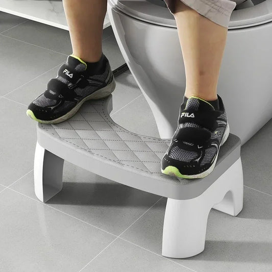Grey toilet squat stool with quilted non-slip seat cushion and U-shaped opening