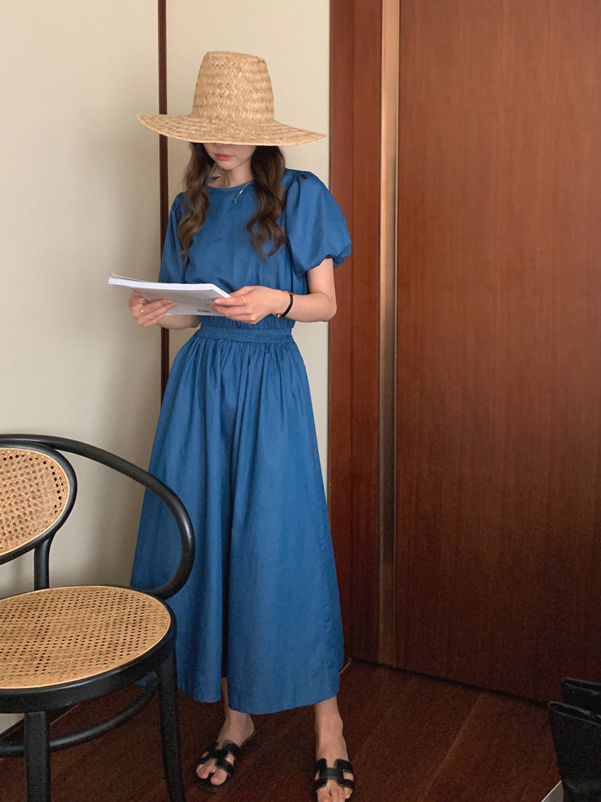 Blue denim puff-sleeve top and gathered midi skirt set, side profile