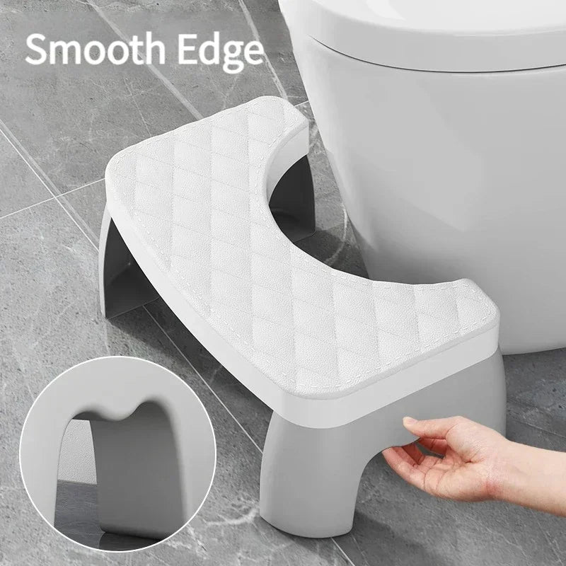 White toilet squat stool with quilted non-slip seat cushion and smooth edge design