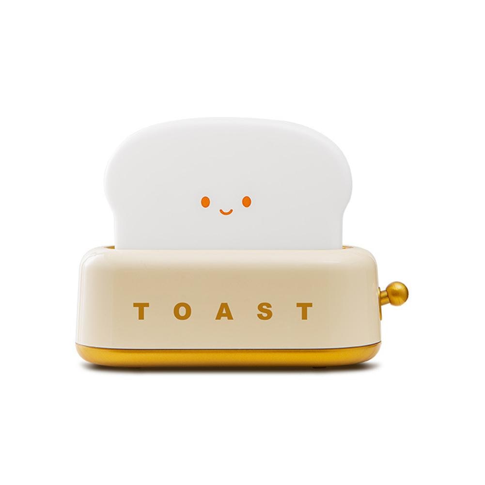 LED toaster night light with cream base and smiling face, golden side knob