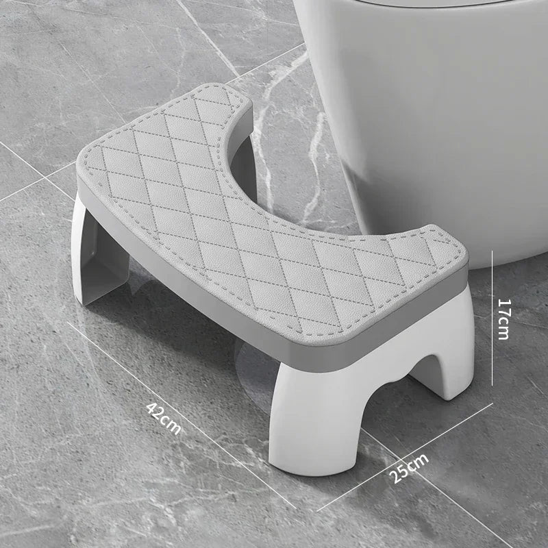 Grey toilet squat stool with quilted non-slip seat cushion and U-shaped opening