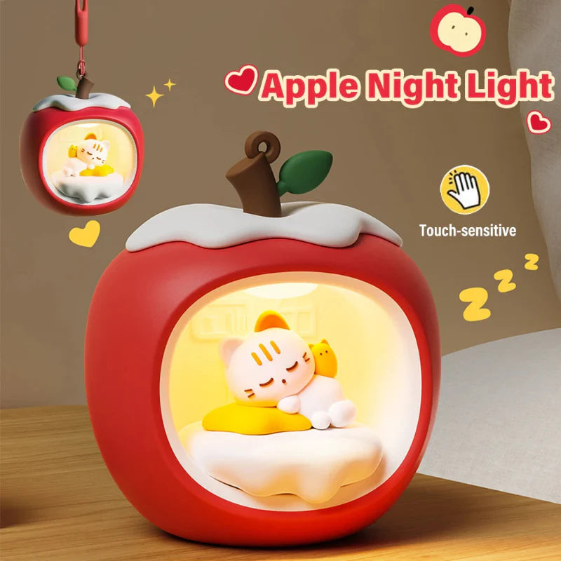 Red apple-shaped touch night light with sleeping cat scene in glowing circular light panel