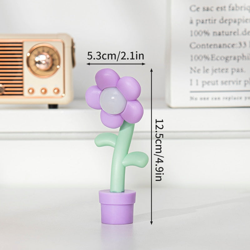 Purple and white flower night light with green stem and purple pot base