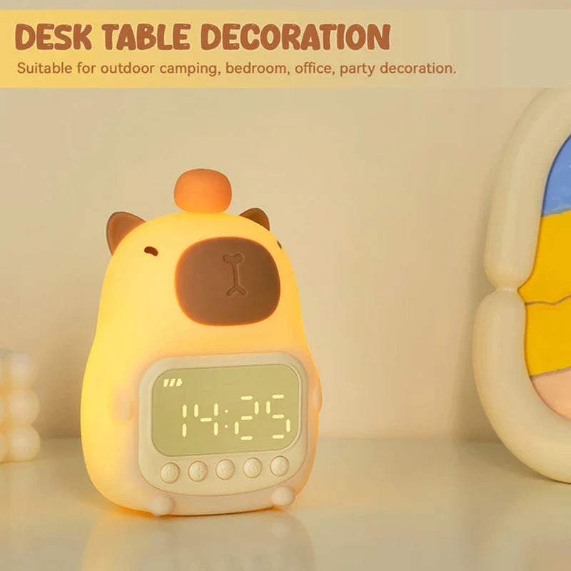Capybara night light alarm clock on desk, front view with glowing digital display