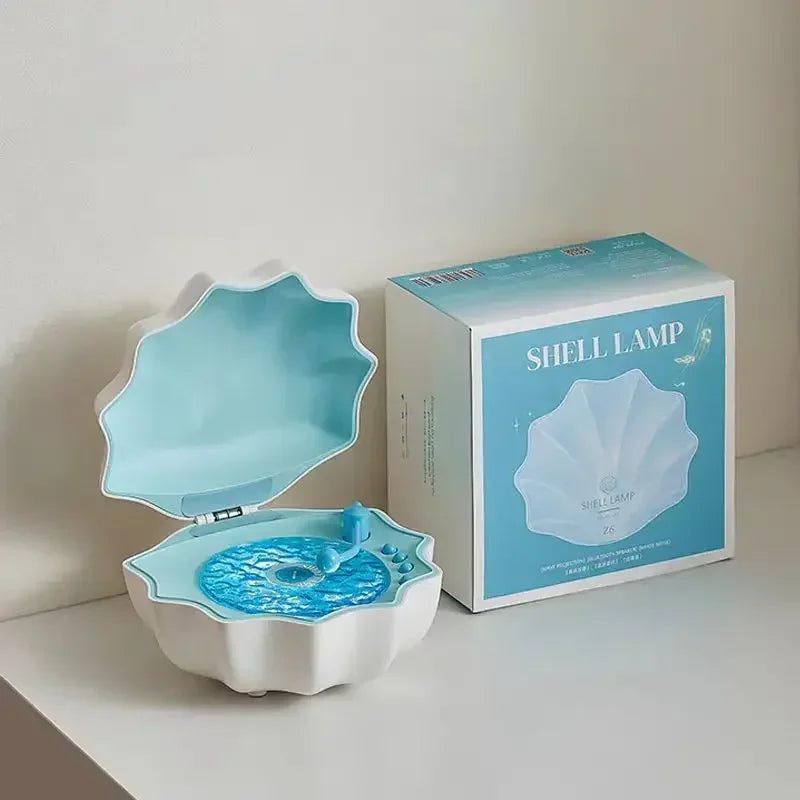 Shell Bluetooth speaker night light with blue open lid; retail box shown