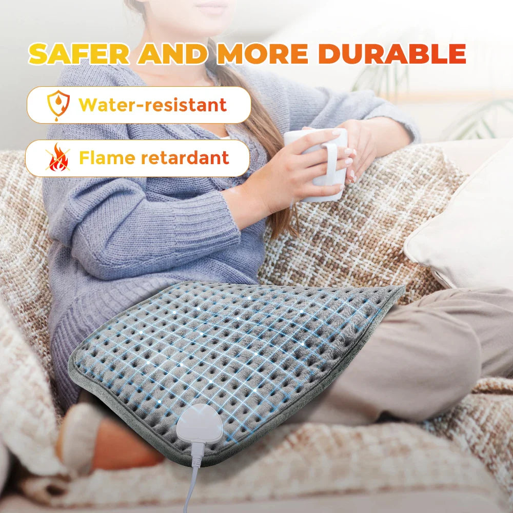 Blue-gray heating pad with visible heating grid and control plug connection